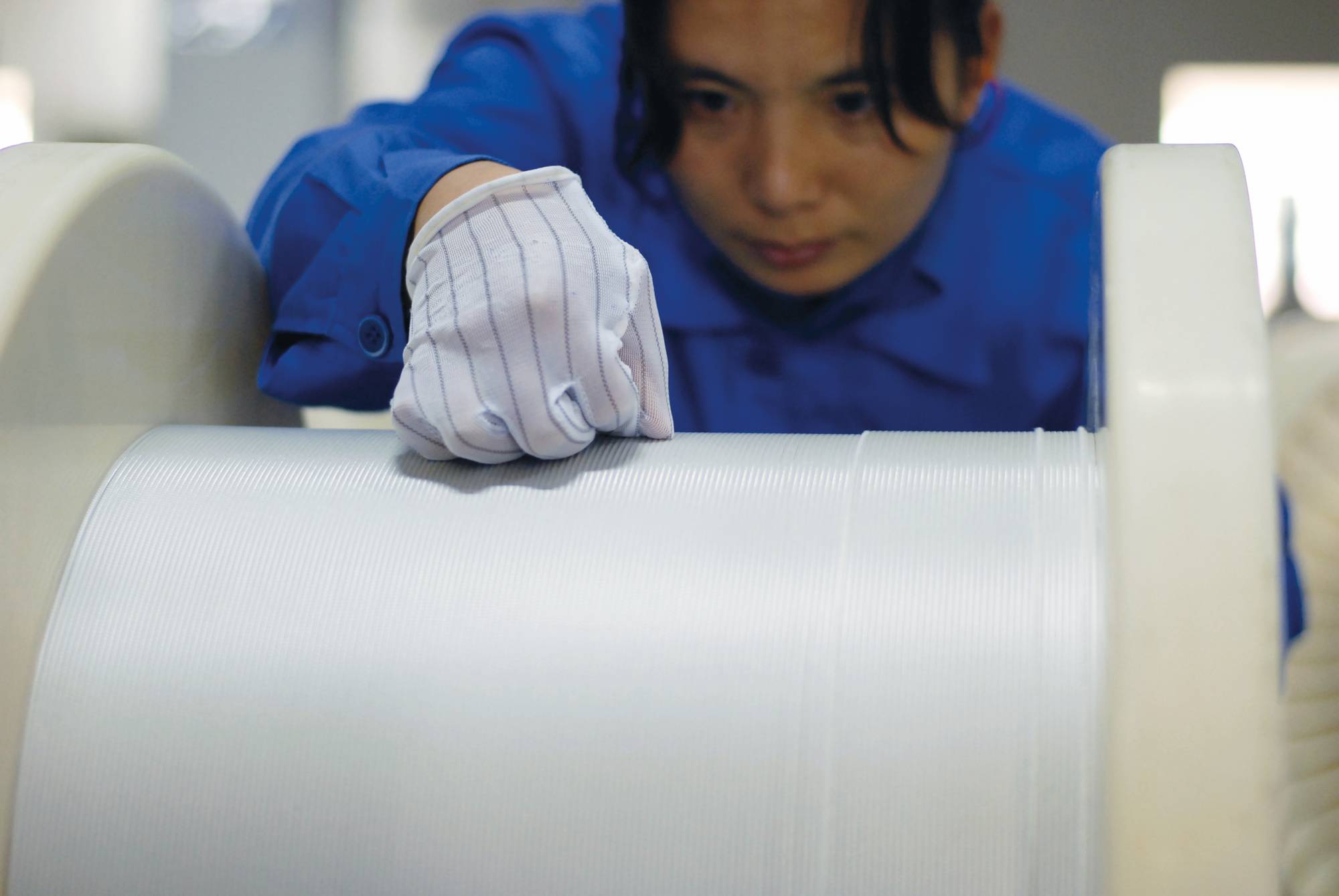 Luvata Zhongshan employee working with braided wire