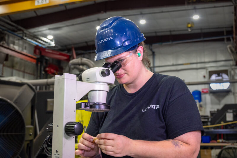 Employee working with microscope